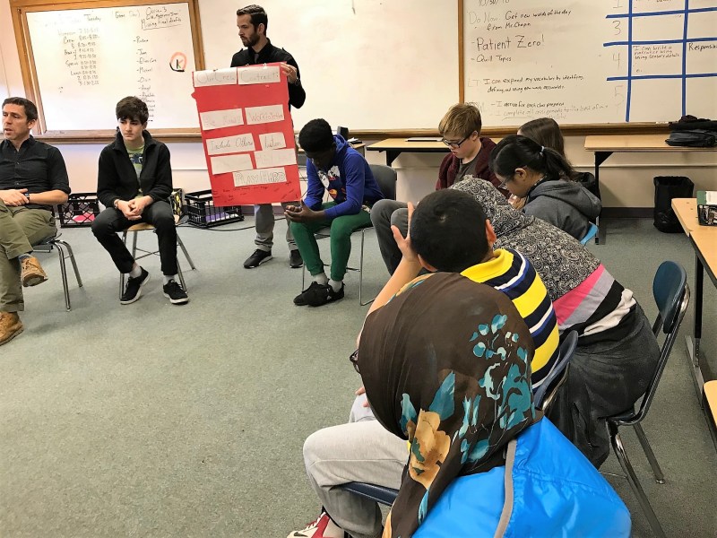 Curtis Chapin, a Crew advisor and language arts teacher at King Middle School in Portland, Maine, reviews the “Crew Contract” signed by each member.