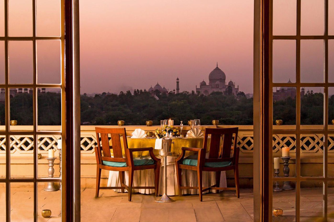 a view of the taj mahal from a balcony.