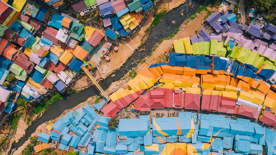 an aerial view of a rainbow colored city.